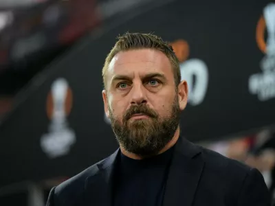 FILE - Then-Roma's head coach Daniele De Rossi waits for the start of the Europa League second leg semi-final soccer match between Leverkusen and Roma at the BayArena in Leverkusen, Germany, Thursday, May 9, 2024. (AP Photo/Matthias Schrader, File)