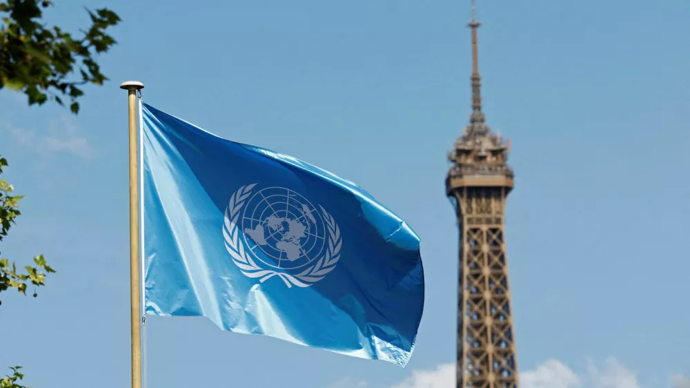 FILE PHOTO: The flag of UNESCO flies at the UNESCO headquarters, with the Eiffel Tower in the background, in Paris, France, April 17, 2025. REUTERS/Abdul Saboor/File Photo