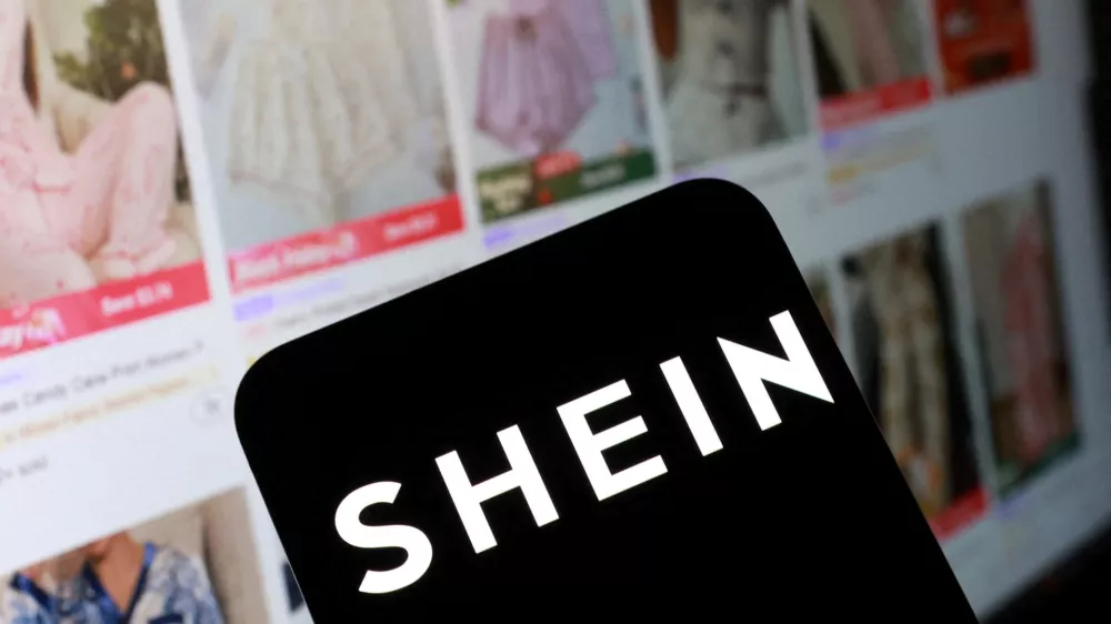 FILE PHOTO: Shein logo and their web page on smartphone in this illustration taken November 5, 2025. REUTERS/Dado Ruvic/Illustration/File Photo