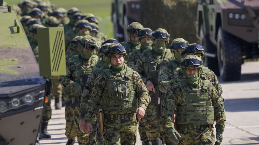 FILE - Serbian Army soldiers perform during a military exercise, at Batajnica Air Base near Belgrade, Serbia, on April 22, 2023. Serbia on Friday, June 23, 2023 reiterated the threat of an armed intervention in its former province of Kosovo, unless the NATO-led peacekeepers stationed there don't protect the minority Serbs there from "the great terror" of the Kosovo "regime." Serbian army chief-of-staff, Gen. Milan Mojsilovic, said that the military stands ready to fulfil its tasks "in accordance to the constitution" and orders from the army supreme commander, President Aleksandar Vucic. (AP Photo/Darko Vojinovic, File)