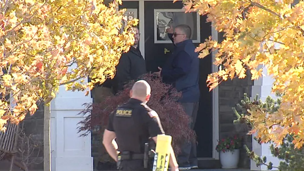 CORRECTS LAST NAME - In this image from video provided by WRTV, investigators work at the site of the fatal shooting of house cleaner Maria Florinda Rios Perez who went to the wrong address in Whitestown, Ind., on Wednesday, Nov. 5, 2025. (WRTV via AP)