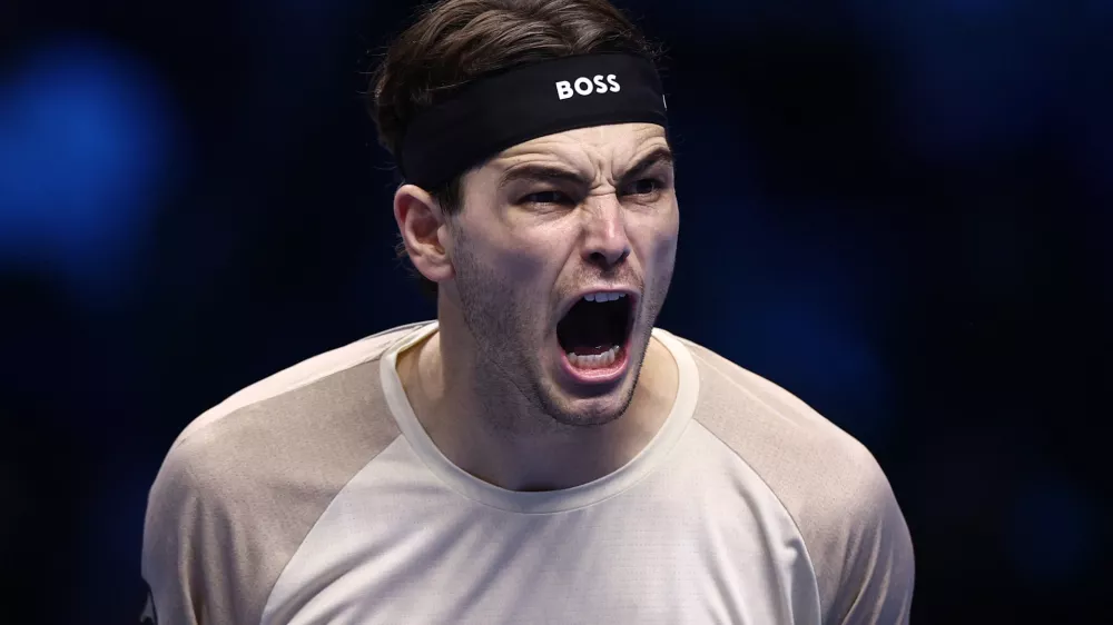 Tennis - ATP Finals - Turin - Palasport Olimpico, Turin, Italy - November 10, 2025 Taylor Fritz of the U.S. celebrates after winning his round robin match against Italy's Lorenzo Musetti REUTERS/Guglielmo Mangiapane