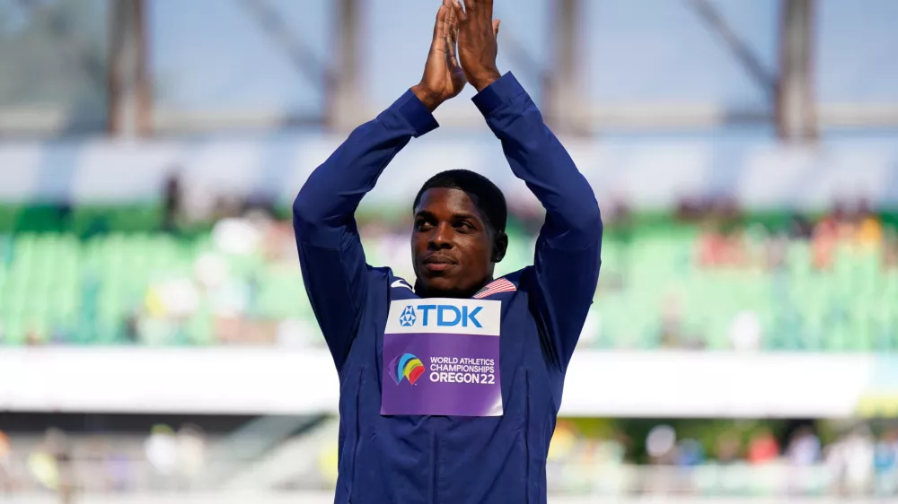 FILE - Silver medalist Marvin Bracy, of the United States, stands on the podium after the final in the men's 100-meter run at the World Athletics Championships, July 17, 2022, in Eugene, Ore. (AP Photo/Ashley Landis, File)