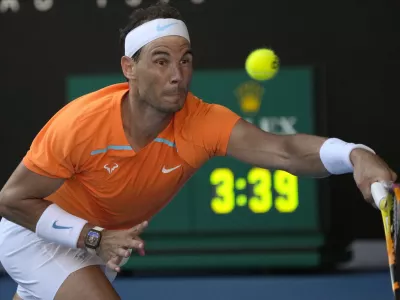 Rafael Nadal of Spain plays a forehand return to Jack Draper of Britain during their first round match at the Australian Open tennis championship in Melbourne, Australia, Monday, Jan. 16, 2023. (AP Photo/Aaron Favila)