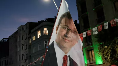 FILE PHOTO: A flag with an image of the jailed Istanbul Mayor Ekrem Imamoglu from the main opposition Republican People's Party (CHP), is displayed during a rally to protest the detention of Beyoglu Mayor Inan Guney as part of a corruption investigation, in Istanbul, Turkey, August 27, 2025. REUTERS/Murad Sezer/File Photo