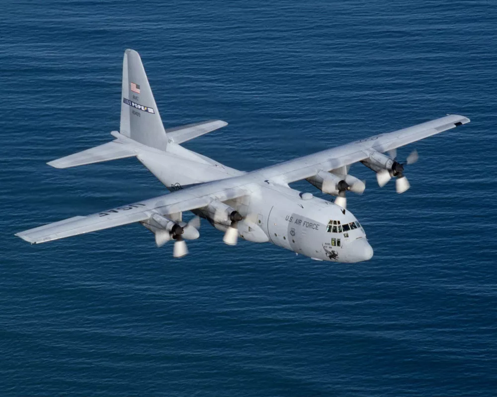 A C-130E from the 2nd Airlift Squadron, Pope AFB, N.C., flies over the Atlantic Ocean along the North Carolina coast. The C-130 Hercules primarily performs the intratheater portion of the airlift mission. The aircraft is capable of operating from rough, dirt strips and is the prime transport for paradropping troops and equipment into hostile areas. (U.S. Air Force photo by Tech. Sgt. Howard Blair)