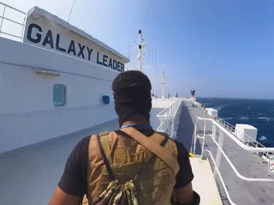 FILE PHOTO: A Houthi fighter stands on the Galaxy Leader cargo ship in the Red Sea in this photo released November 20, 2023. Houthi Military Media/Handout via REUTERS  THIS IMAGE HAS BEEN SUPPLIED BY A THIRD PARTY/File Photo