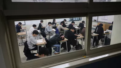 Students wait for the start of the annual college entrance examinations at an exam hall in Seoul, South Korea, Thursday, Nov. 13, 2025. (Kim Hong-Ji/Pool Photo via AP)