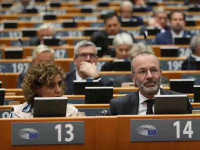 Manfred Weber, Group of the European People's Party (Christian Democrats), right, attends a commemoration on the 10th anniversary of the November 13, 2015 Paris attacks, at the European Paliament in Brussels, Wednesday, Nov. 12, 2025. (AP Photo/Virginia Mayo)