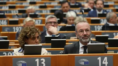 Manfred Weber, Group of the European People's Party (Christian Democrats), right, attends a commemoration on the 10th anniversary of the November 13, 2015 Paris attacks, at the European Paliament in Brussels, Wednesday, Nov. 12, 2025. (AP Photo/Virginia Mayo)