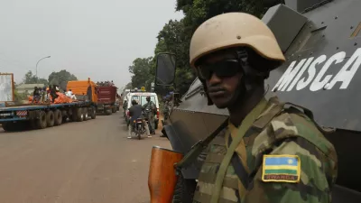 ﻿African peace keeping soldiers escort a humanitarian convoy in Bangui, February 15, 2014. France said on Friday it plans to send another 400 troops to help combat a crisis in the Central African Republic as U.N. chief Ban Ki-moon pleaded for more swift, robust international help to stop sectarian violence that could turn into a genocide. REUTERS/Luc Gnago (CENTRAL AFRICAN REPUBLIC - Tags: POLITICS CIVIL UNREST MILITARY) - RTX18VGQ