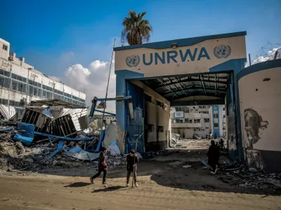 FILED - 10 February 2024, Palestinian Territories, Gaza City: Palestinians examine the damage in front of the United Nations Relief and Works Agency for Palestine Refugees (UNRWA) buildings in Gaza City. Photo: Omar Ishaq/dpa