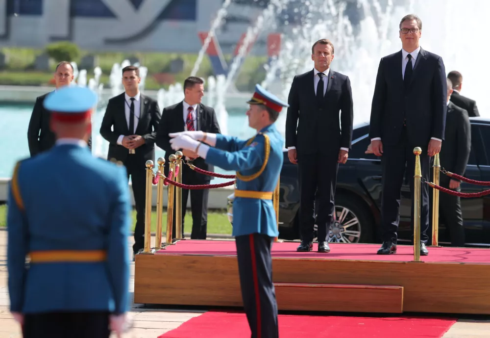 ﻿Serbian President Aleksandar Vucic and French President Emmanuel Macron inspect an honour guard outside the Serbia Palace building in Belgrade, Serbia, July 15, 2019. REUTERS/Djordje Kojadinovic