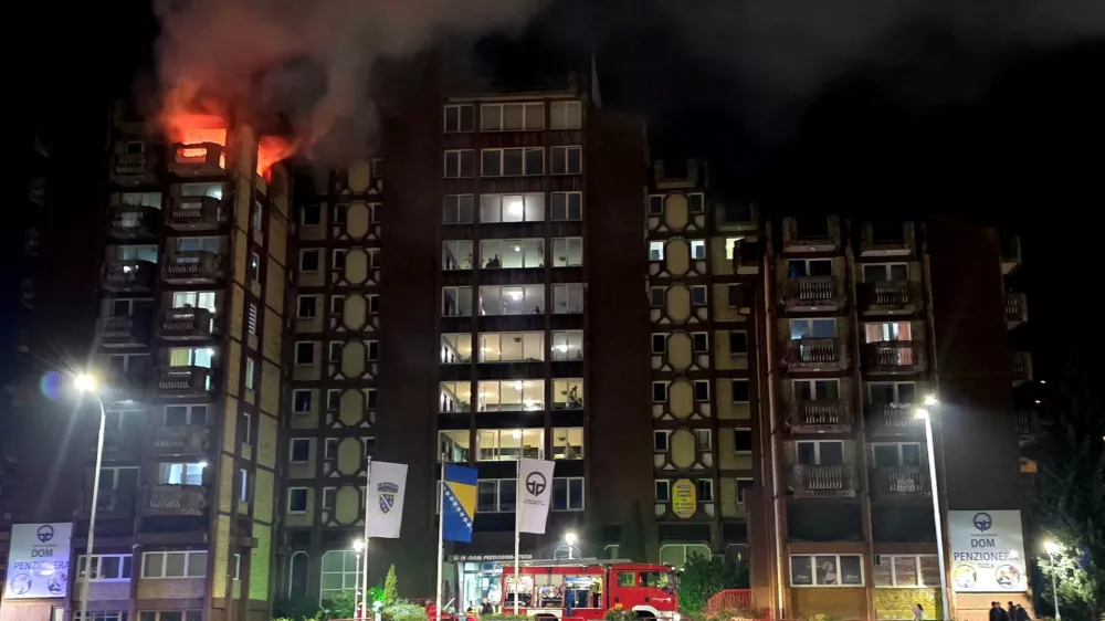Flames rise as a fire burns at an elderly people's home, in the town of Tuzla, Bosnia and Herzegovina, November 4, 2025. REUTERS/Mersiha Bajric NO RESALES. NO ARCHIVES   TPX IMAGES OF THE DAY