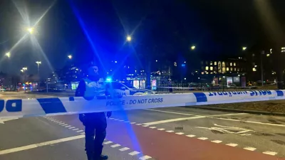 A Swedish police officer stands near the site where a bus hit a bus stop in central Stockholm, Sweden, November 14, 2025. REUTERS/Marie Mannes