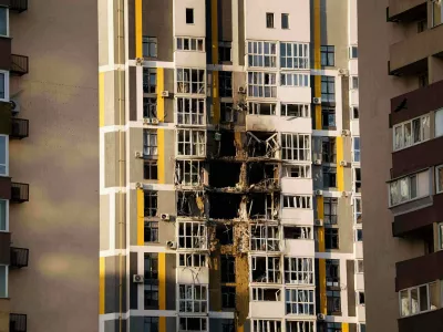 A residential building shows damage after a Russian attack on Kyiv, Ukraine, Friday, Nov. 14, 2025. (AP Photo/Evgeniy Maloletka)