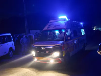 An ambulance leaves the site of an explosion inside a police station in Srinagar, Indian controlled Kashmir, Friday, Nov. 14, 2025. (AP Photo/Yasin Dar)