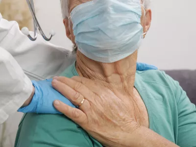 Portrait of elderly caucasian woman wearing protective medical mask. Care for the elderly people during corona virus outbreak, a helping hand, home care concept.