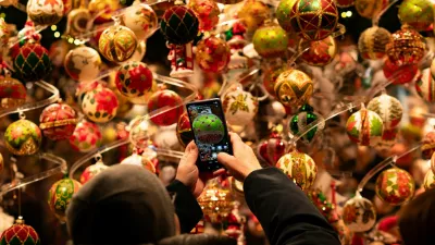 A person takes a picture of Christmas decorations at the Wiener Christkindlmarkt in front of Vienna's city hall, one of the city's most popular Christmas markets in Vienna, Austria, November 15, 2025. REUTERS/Elisabeth Mandl