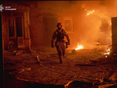 A firefighter works at the site of a Russian military strike, amid Russia's attack on Ukraine, in Sumy region, Ukraine, in this handout picture released November 16, 2025. Press service of the State Emergency Service of Ukraine in Sumy region/Handout via REUTERS ATTENTION EDITORS - THIS IMAGE HAS BEEN SUPPLIED BY A THIRD PARTY. MUST NOT OBSCURE LOGO.