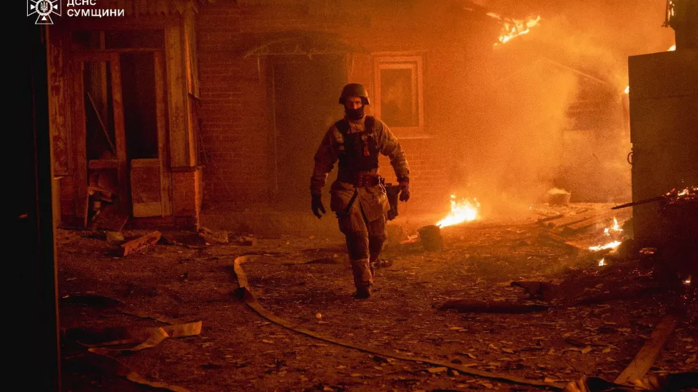 A firefighter works at the site of a Russian military strike, amid Russia's attack on Ukraine, in Sumy region, Ukraine, in this handout picture released November 16, 2025. Press service of the State Emergency Service of Ukraine in Sumy region/Handout via REUTERS ATTENTION EDITORS - THIS IMAGE HAS BEEN SUPPLIED BY A THIRD PARTY. MUST NOT OBSCURE LOGO.