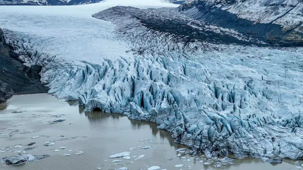 March 25, 2025, Skaftafell, Skaftafell, Iceland: An aerial view of Skaftafell Glacier. Skaftafell Glacier, part of VatnajÃ¶kull National Park in Iceland, is a stunning natural wonder characterized by its breathtaking ice formations and rugged landscapes. Skaftafell Glacier, Skaftafell, Iceland, 25th March 2025.,Image: 979375227, License: Rights-managed, Restrictions:, Model Release: no