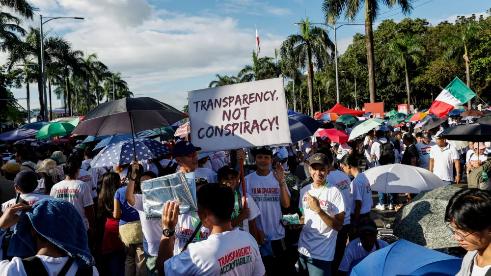 Members of the religious sect Iglesia Ni Cristo (Church of Christ) hold a placard as they participate in a three-day anti-corruption rally at Manila's Rizal Park, Philippines, Sunday, Nov. 16, 2025. (AP Photo/Mark Cristino)