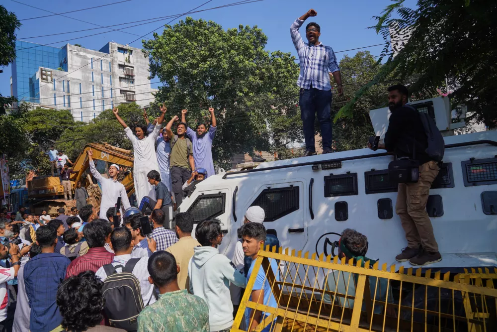 Protesters shout slogans outside the demolished residence of Sheikh Mujibur Rahman, Bangladesh's former leader and the father of the country's ousted Prime Minister Sheikh Hasina ahead of an expected verdict against Hasina, in Dhaka, Bangladesh, Monday, Nov. 17, 2025. (AP Photo/ Ahadul Karim Khan)