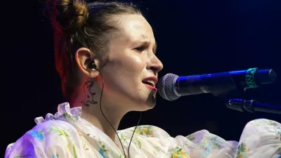 Russian pop icon Elizaveta Andreevna Gyrdymova aka Monetochka performs in front of more than a thousand fans, mainly Ukrainians and Belarusians, during an anti-war concert in Warsaw, Poland, on April 21, 2022. Russian rapper Noize MC and his touring partner Monetochka have raised more than 200,000 euros for a Polish charity helping refugees with their concert series titled "Voices of Peace.",Image: 686113875, License: Rights-managed, Restrictions: TO GO WITH AFP STORY by Ola CICHOWLAS, Model Release: no