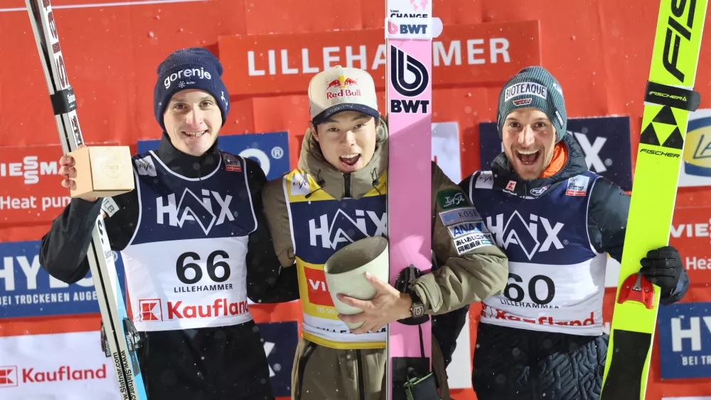 Winner Japan's Ryoyu Kobayashi, center, on the podium with second placed Domen Prevc, left, and third placed Germany's Felix Hoffmann after the men's world cup competition in the large Lysgardsbakken at the ski jumping world cup in Lillehammer, Norway, Sunday Nov. 23, 2025. (Geir Olsen/NTB via AP)