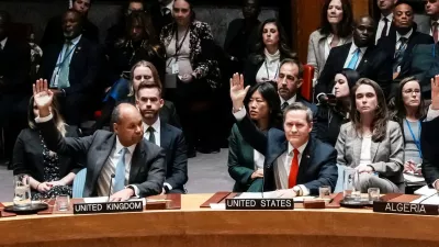 U.S Ambassador to United Nations Michael Waltz and Britain's Deputy Ambassador to the United Nations James Kariuki vote in favor for a resolution during a meeting of the United Nations Security Council to consider a U.S. proposal for a U.N. mandate to establish an international stabilization force in Gaza, at U.N. headquarters in New York City, U.S., November 17, 2025. REUTERS/Eduardo Munoz