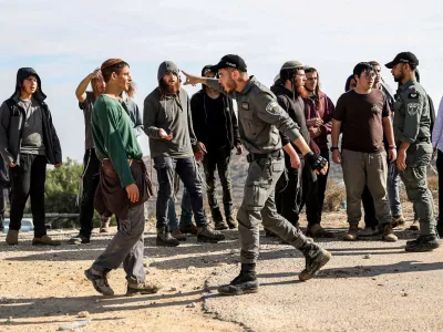 Israeli border police and a protester argue as Tzur Misgavi, an unauthorised Israeli settler outpost, is dismantled by Israeli security forces, in the Israeli-occupied West Bank, November 17, 2025. REUTERS/Naama Stern   TPX IMAGES OF THE DAY