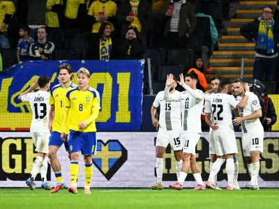 Soccer Football - FIFA World Cup - UEFA Qualifiers - Group B - Sweden v Slovenia - Strawberry Arena, Stockholm, Sweden - November 18, 2025 Slovenia's Timi Elsnik celebrates scoring their first goal with Adam Gnezda Cerin Pontus Lundahl/TT News Agency via REUTERS   ATTENTION EDITORS - THIS IMAGE WAS PROVIDED BY A THIRD PARTY. SWEDEN OUT. NO COMMERCIAL OR EDITORIAL SALES IN SWEDEN.