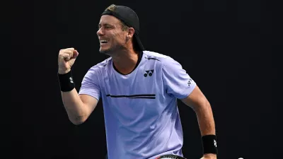 FILE - Australia's Lleyton Hewitt celebrates with compatriot John-Patrick Smith during their first round doubles match against New Zealand's Marcus Daniels and Wesly Koolhof of the Netherlands at the Australian Open tennis championships in Melbourne, Australia, Jan. 17, 2019. (AP Photo/Andy Brownbill, File)