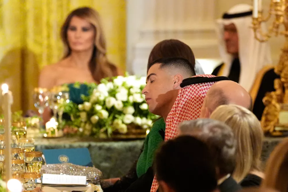Cristiano Ronaldo, center, attends a dinner with President Donald Trump and Saudi Arabia's Crown Prince Mohammed bin Salman in the East Room of the White House, Tuesday, Nov. 18, 2025, in Washington. (AP Photo/Alex Brandon)