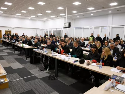 Prosecutors, defendants and lawyers background are seen inside a courtroom near Skopje, North Macedonia, on Wednesday, Nov. 19, 2025, ahead the start of the trial over the Kocani nightclub fire, eight months after the country's deadliest blaze killed 63 people and injured more than 200. (AP Photo/Boris Grdanoski)