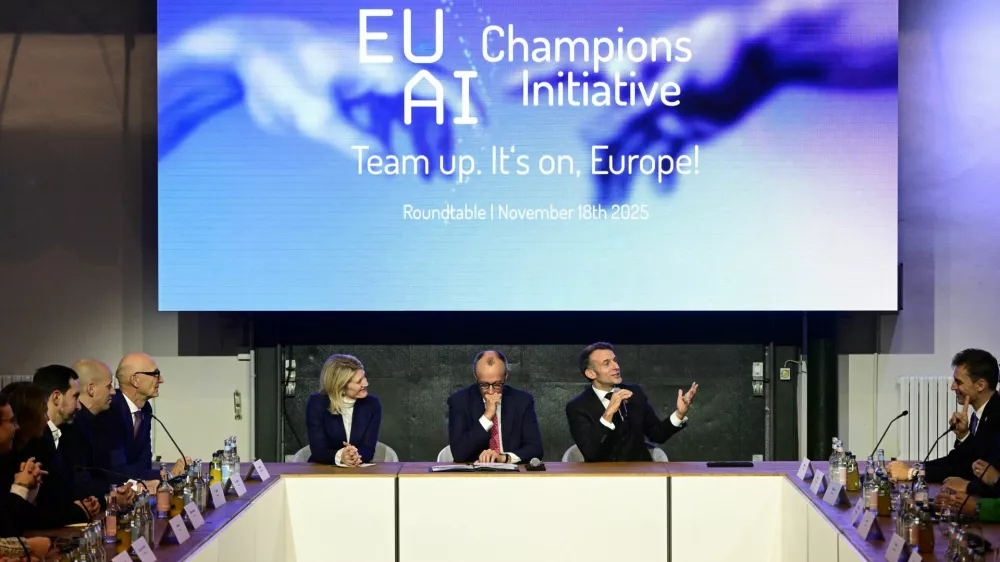 France's President Emmanuel Macron addresses investors next to German chancellor Friedrich Merz and Managing director and Head of Europe at General Catalyst Jeannette zu F&uuml;rstenberg at the EU AI Champions Initiative at a summit on Europe's technological sovereignty, in the EUREF Campus in Berlin, Germany, November 18, 2025. JOHN MACDOUGALL/Pool via REUTERS