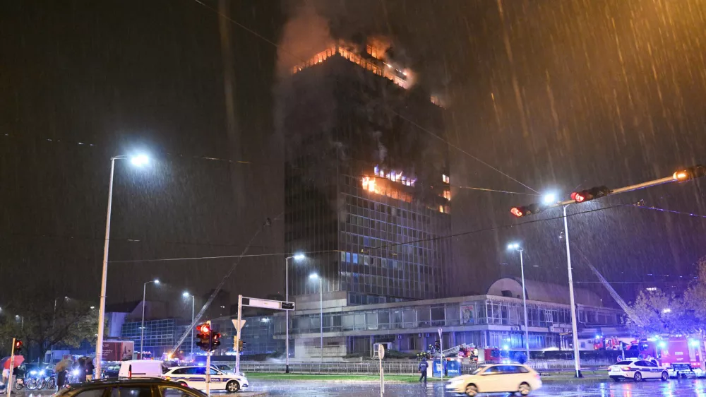Firefighters work to extinguish the fire that caught 'Vjesnik' skyscraper, which used to accommodate most of Croatian media companies, in Zagreb, Croatia, early Tuesday, Nov. 18, 2025. (AP Photo/Damir Krajac)