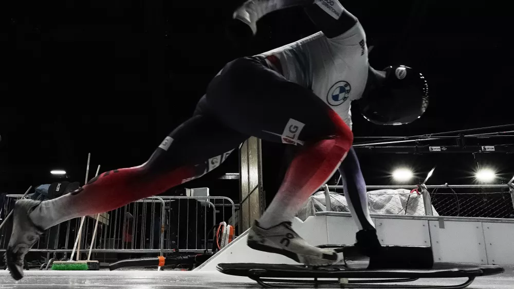 South Korea's Jung Seunggi takes the start at a training session ahead of a three day skeleton and bobsled World Cup stage and Olympic test event in Cortina D'Ampezzo, Italy, Wednesday, Nov. 19, 2025. (AP Photo/Andrew Medichini)