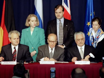 President Slobodan Milosevic of Serbia (L), President Alija Izetbegovic of Bosnia-Herzegovina (C) and President Franjo Tudjman of Croatia sign the Dayton Agreement peace accord at the Hope Hotel inside Wright-Patterson Air Force Base in this November 21, 1995 file photo. U.N. war crimes tribunal president Fausto Pocar said on March 12, 2006 a Dutch forensic team had not been able to determine the cause of death of Milosevic on Saturday which is why an autopsy was ordered. REUTERS/Eric Miller/Files
