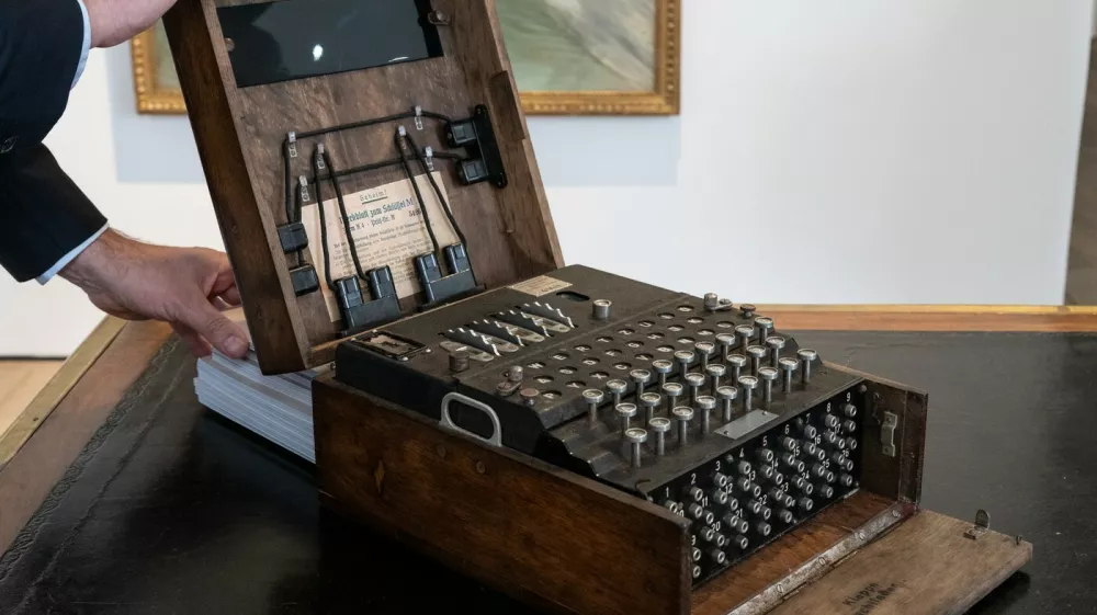 This photograph shows an Enigma M4 rotor key machine used for encrypted communication during World War II, ahead of its' auction exhibited at the Christie's auction house in Paris on November 13, 2025. The Enigma M4 machine will be auctionned on November 18, 2025 at the Christie's auction house in Paris.,Image: 1052237667, License: Rights-managed, Restrictions:, Model Release: no
