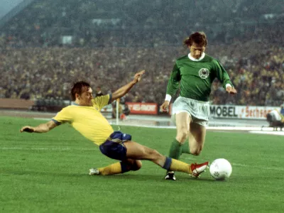 30 June 1974, Duesseldorf: German striker Dieter Herzog (R) in action against Swedish defender Jan Olsson during the 1974 World Cup Group B soccer match between Germany and Sweden at the Rheinstadion. Dieter Herzog, a 1974 World Cup winner with West Germany, passed away this week, a Leverkusen spokesman said, citing Herzog's family. Photo: Karl Schnörrer/dpa