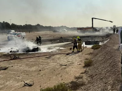 Firefighters work at the site of a crash involving an Indian-made HAL Tejas fighter jet at the Dubai Air Show, United Arab Emirates, November 21, 2025, in this handout picture obtained from social media. Government of Dubai Media Office/Handout via REUTERS THIS IMAGE HAS BEEN SUPPLIED BY A THIRD PARTY. MANDATORY CREDIT.