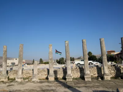 A Palestinian flag flies over the Roman historical site in the West Bank town of Sebastia Thursday, Nov. 20, 2025. (AP Photo/Nasser Nasser)