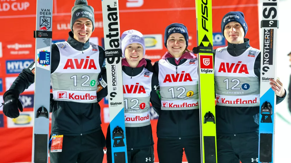 Slovenia celebrates their second place in the mixed team competition during the World Cup ski jumping in the large Lysg&aring;rdsbakken in Lillehammer, Norway, Friday Nov. 21, 2025. (Geir Olsen/NTB via AP)