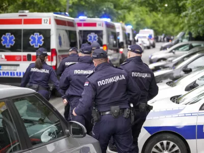 FILE - Police officers block the streets surrounding the Vladislav Ribnikar school in Belgrade, Serbia, Wednesday, May 3, 2023. A teenage boy opened fire at the school on the morning of May 3, 2023. Eight children and a school guard died, and seven people were wounded. One of the wounded, a child, died from injuries later. A total of 10 people were killed. (AP Photo/Darko Vojinovic, File)