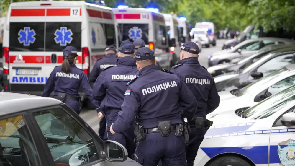 FILE - Police officers block the streets surrounding the Vladislav Ribnikar school in Belgrade, Serbia, Wednesday, May 3, 2023. A teenage boy opened fire at the school on the morning of May 3, 2023. Eight children and a school guard died, and seven people were wounded. One of the wounded, a child, died from injuries later. A total of 10 people were killed. (AP Photo/Darko Vojinovic, File)