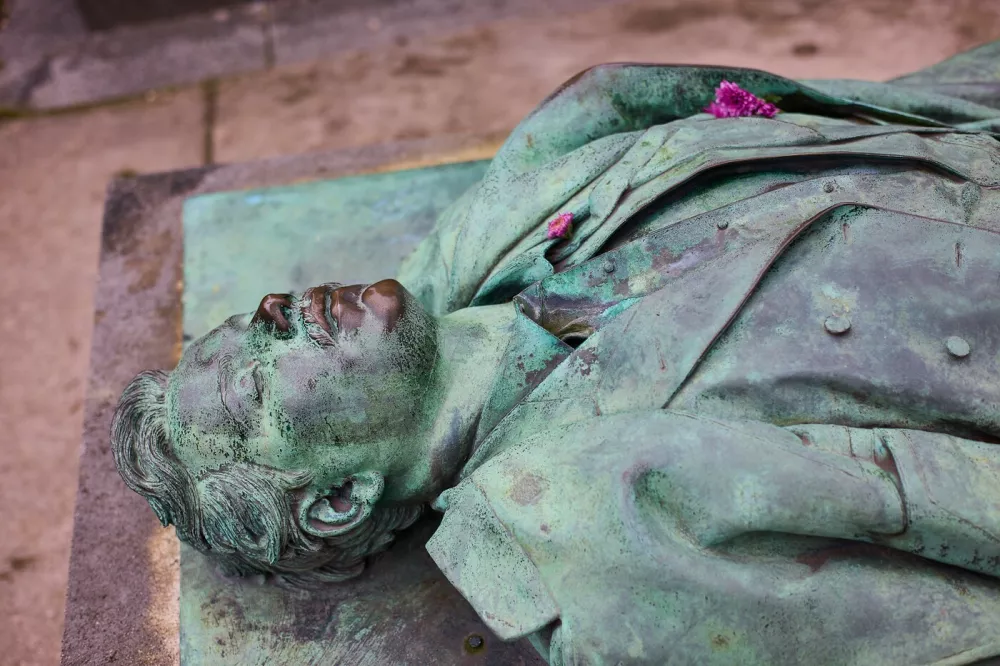 Paris, Cimetière du Père-Lachaise, grave of the journalist Victor Noir, who was shot by Prince Pierre Napoleon Bonaparte during a duel, The naturalistic-style tomb was created by the sculptor Jules Dalou in 1891.Paris, 08, November 2024.,Image: 940016831, License: Rights-managed, Restrictions:, Model Release: no