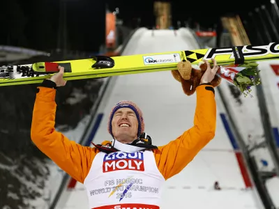 ﻿Germany's Severin Freund poses after winning the mens' Large Hill Individual competition at the Nordic Skiing World Championships in Falun, Sweden, Thursday, Feb. 26, 2015. (AP Photo/Matthias Schrader)