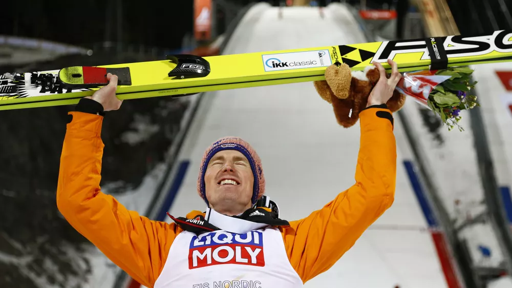 ﻿Germany's Severin Freund poses after winning the mens' Large Hill Individual competition at the Nordic Skiing World Championships in Falun, Sweden, Thursday, Feb. 26, 2015. (AP Photo/Matthias Schrader)